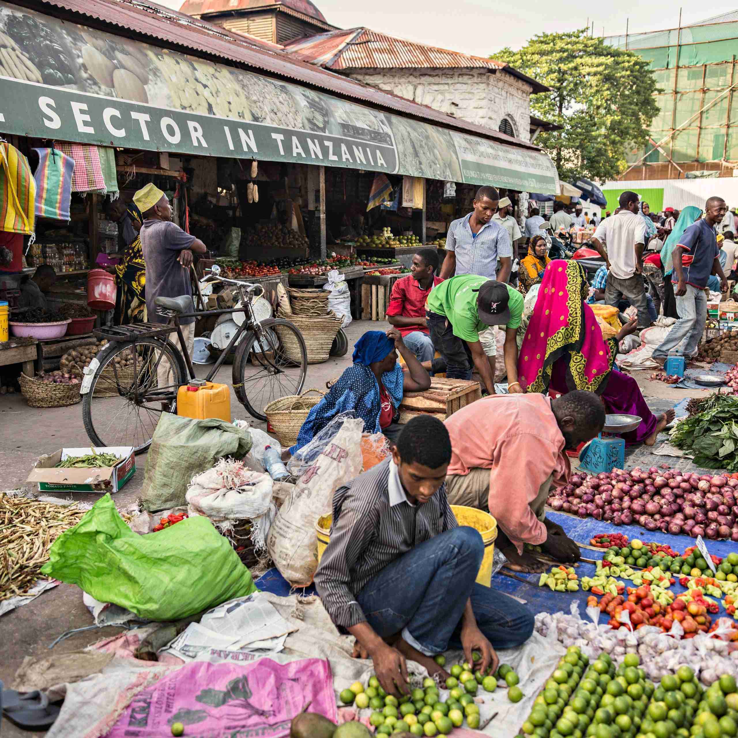 STONE TOWN, TANZANIA - January 2018 Overcrowded local fruit and vegetable market with lots of sellers and buyers in Stone town, Zanzibar, Tanzania